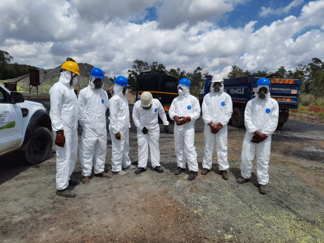 Crew with full respiratory protection on a hazardous site