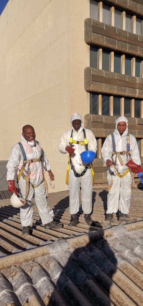Yanga crew removing asbestos roof sheets at height